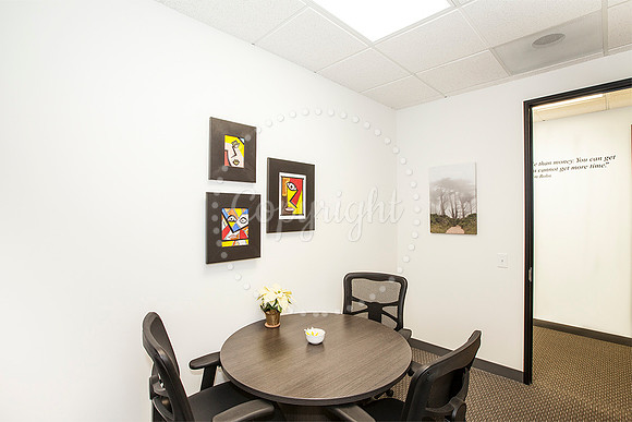 Ribbon Cutting for Jay McDowell. My Photos on walls.
