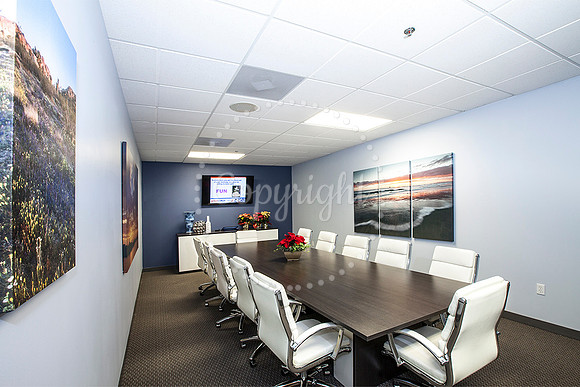 Ribbon Cutting for Jay McDowell. My Photos on walls.