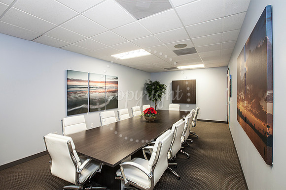Ribbon Cutting for Jay McDowell. My Photos on walls.