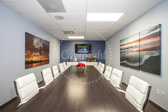 Ribbon Cutting for Jay McDowell. My Photos on walls.